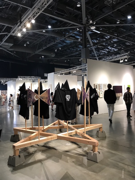 "W.I.T.C.H. 1985," (performance still), Seattle Art Fair, CenturyLink Field Event Center, 2017.